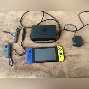 Nintendo Switch with Blue, Yellow and Gray Joy-Con